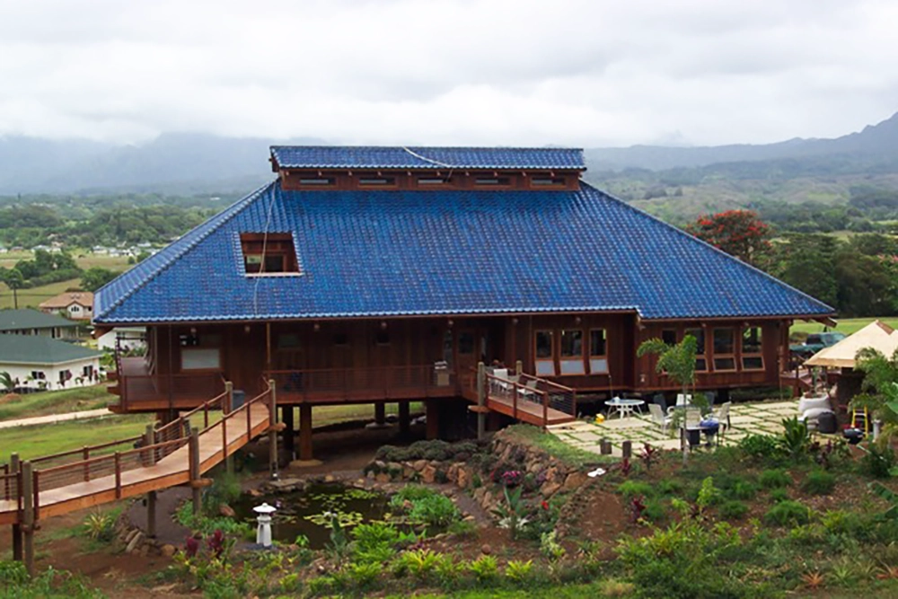 Image of round pole house finished exterior